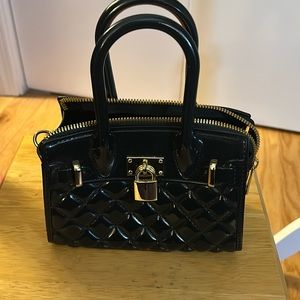 Black rubber/plastic mini bag with crossbody chain